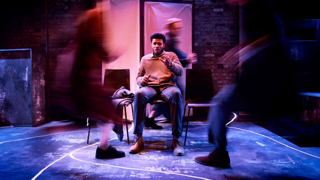 Arcola Theatre: Man on stage with blurred figures in motion