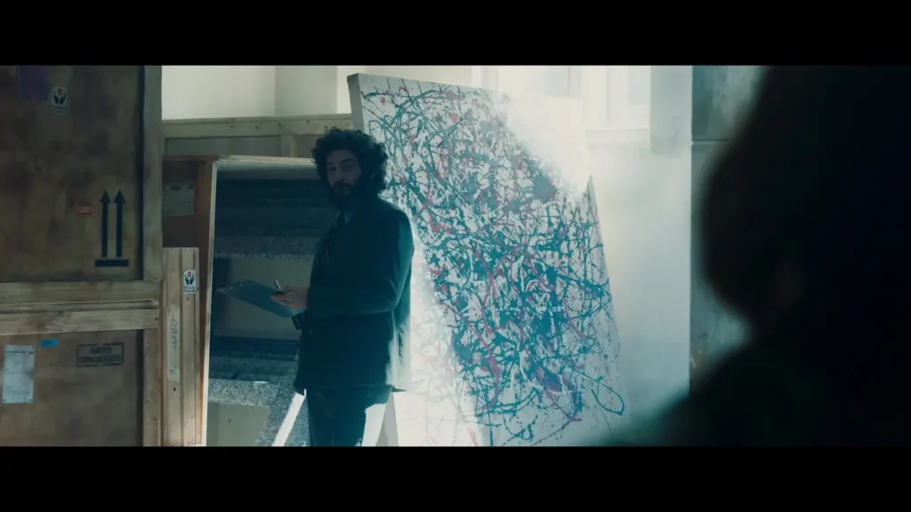 Artist in studio with abstract painting, Secret Invasion.