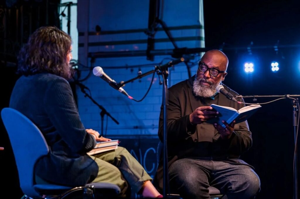 Two people reading at Push the Boat Out 2023 event