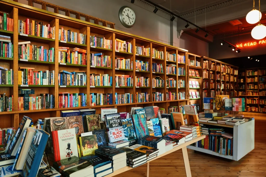 Edinburgh bookshop interior with shelves full of books and a large clock