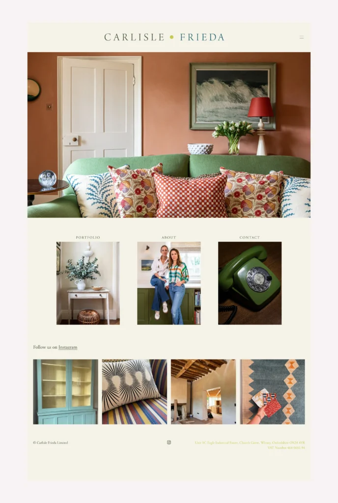 Carlisle Frieda: Living room with salmon pink walls, green sofa, and patterned cushions