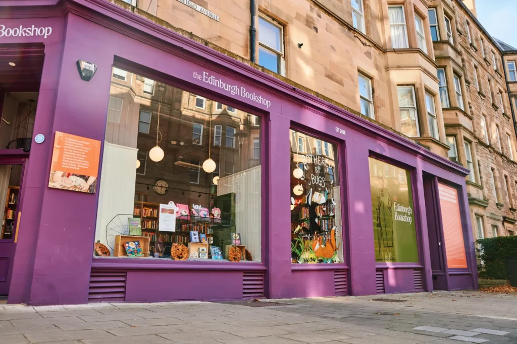 The Edinburgh Bookshop exterior with purple facade and large display windows.