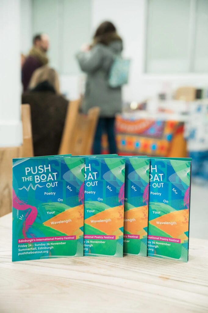 Push the Boat Out poetry festival brochures on a table