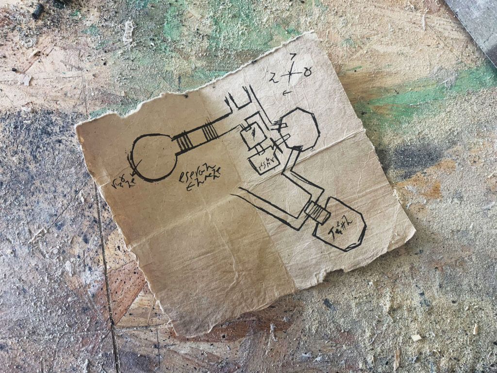 Hand-drawn Dungeons & Dragons dungeon map on crumpled paper.