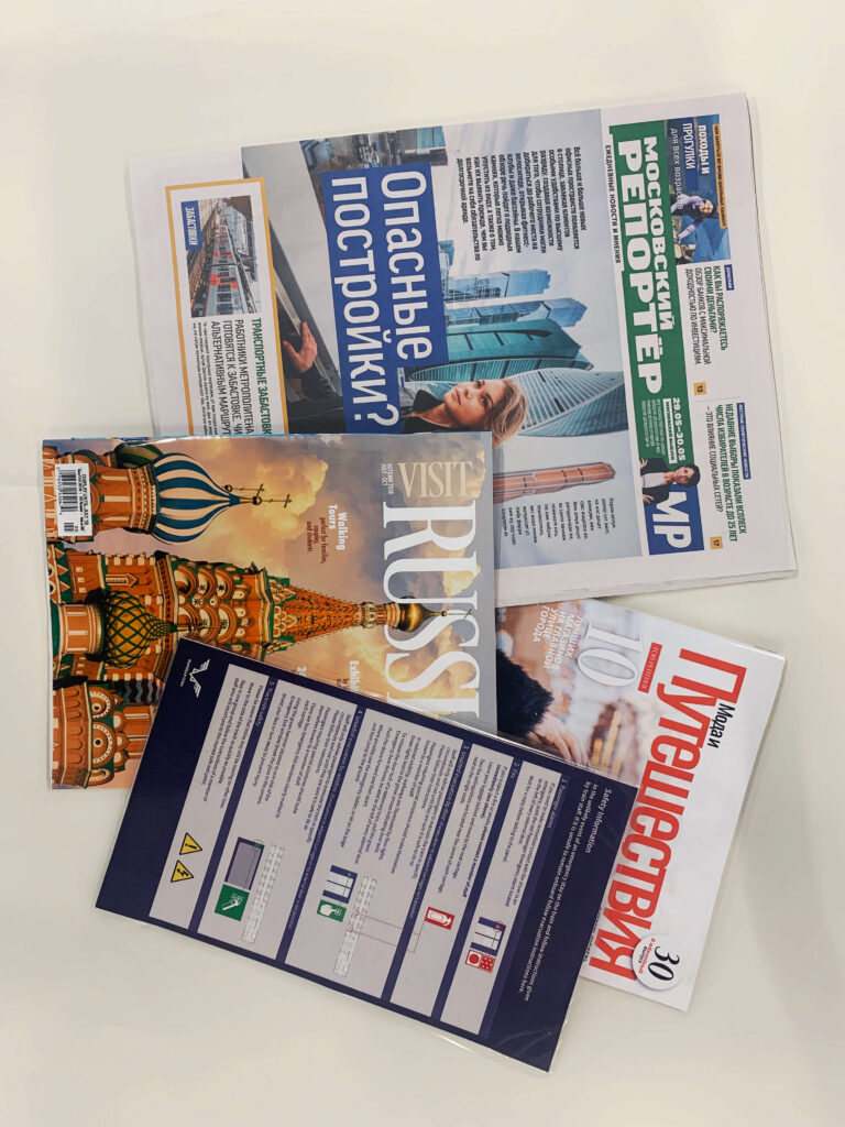 Moscow Reporter magazine covers, one featuring "Dangerous Construction?