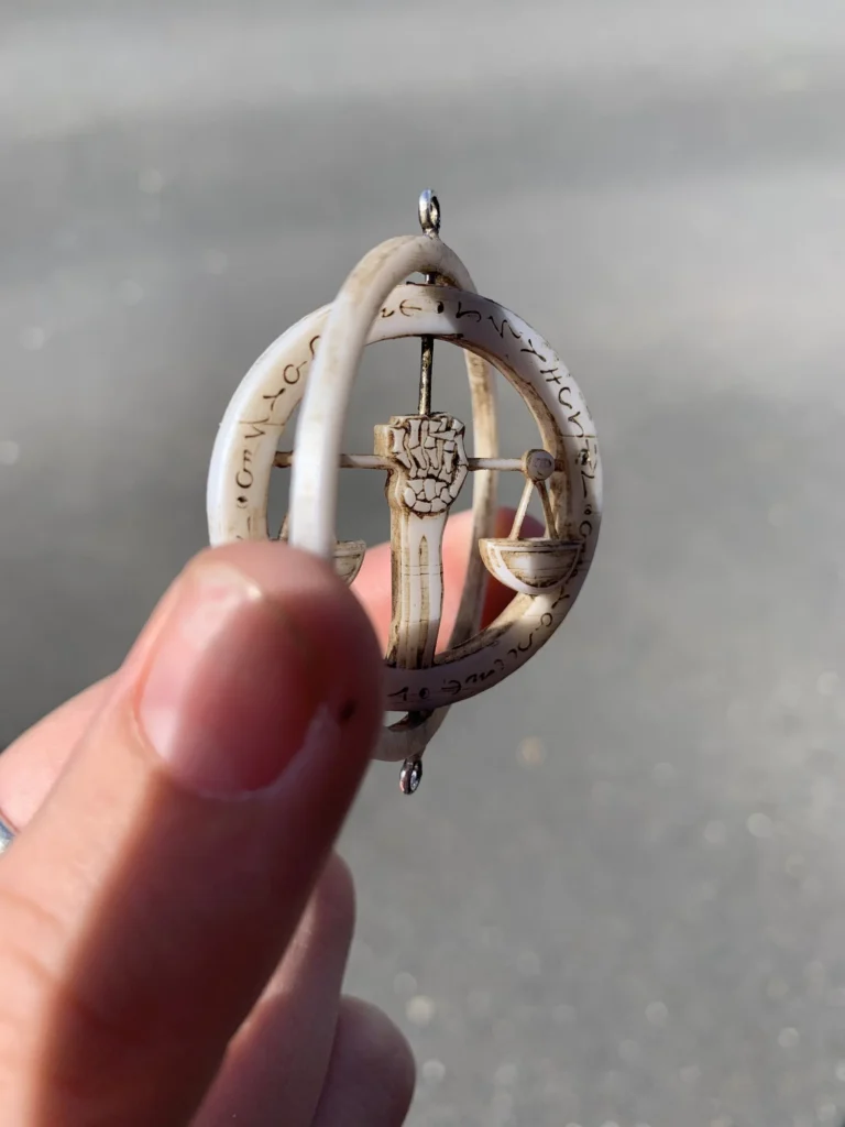 D&D miniature armillary sphere with scales and inscribed text
