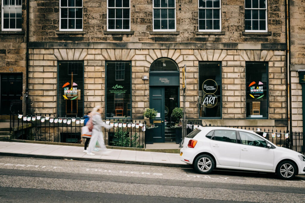 Scottish Gallery in Edinburgh during New Town Art Month, featuring art and a white car.