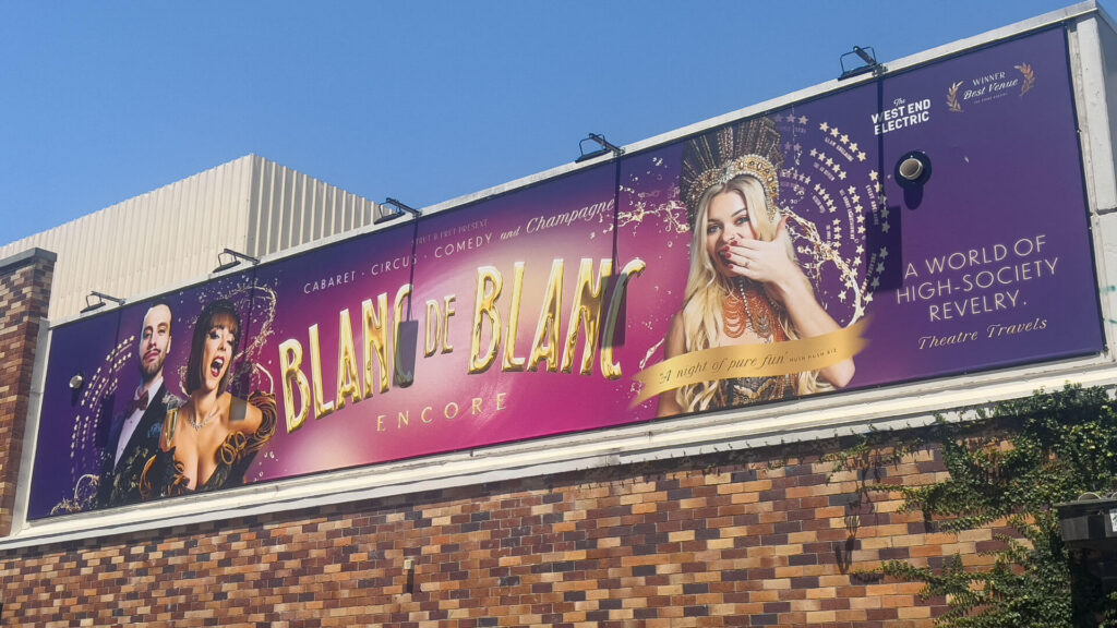 Blanc de Blanc Encore billboard featuring performers and the tagline "A night of pure fun.