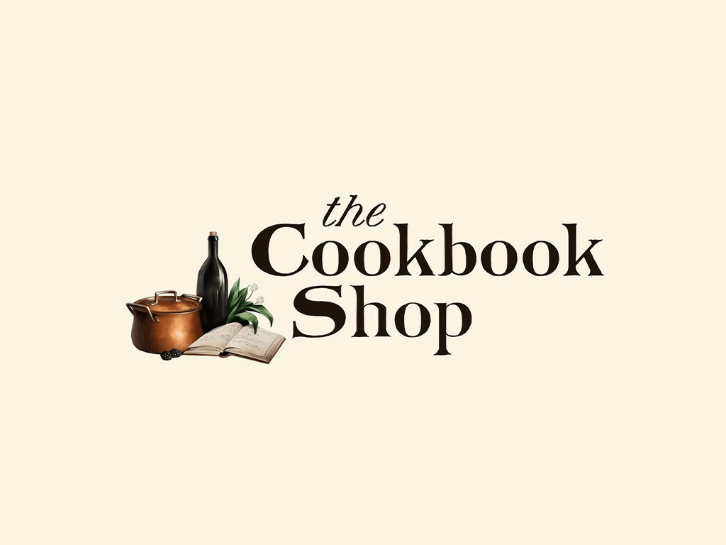 The Cookbook Shop logo with a copper pot, wine bottle, and open book