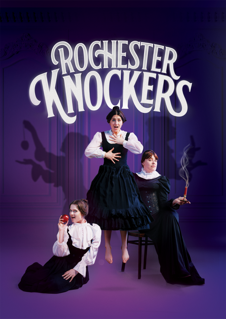 Rochester Knockers: Three women in vintage costumes on a purple stage.