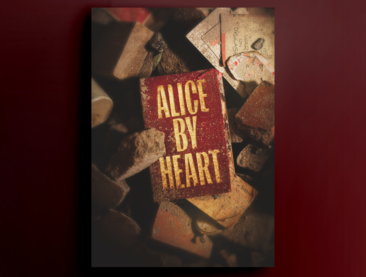 Red book cover with "Alice By Heart" in gold text, surrounded by bricks and old papers.